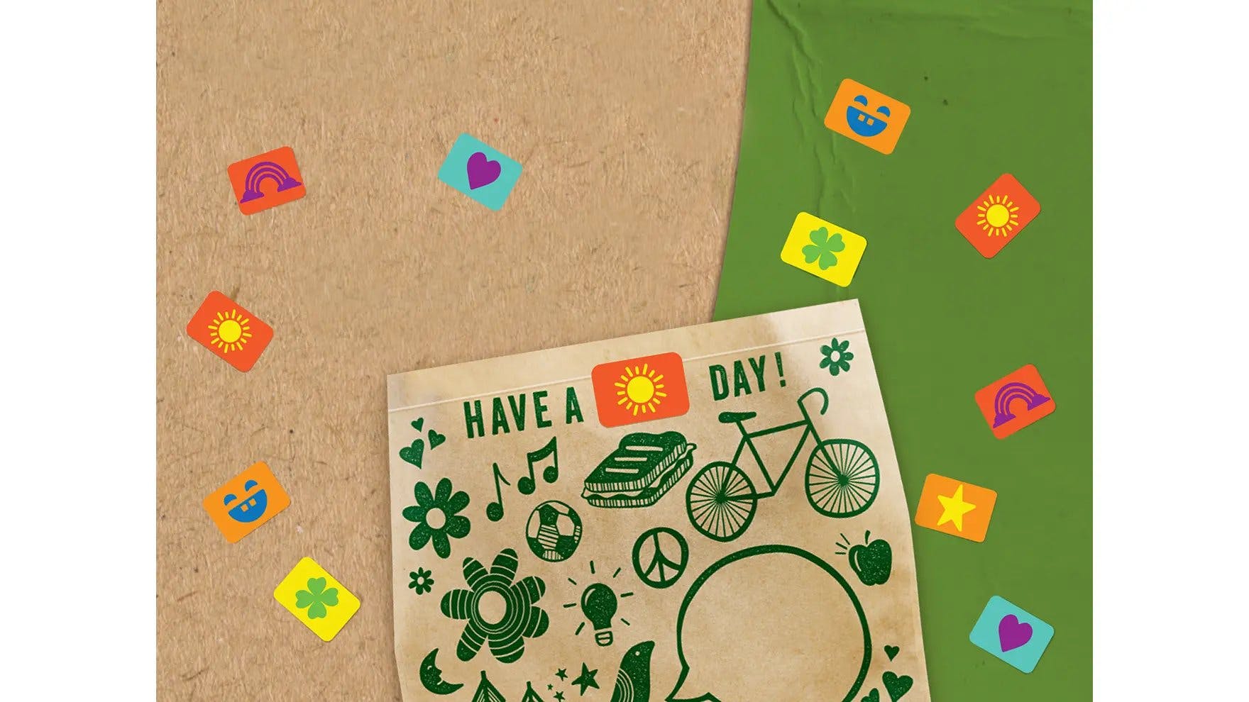 A Ziploc® brand recycleable paper bag surrounded by stickers