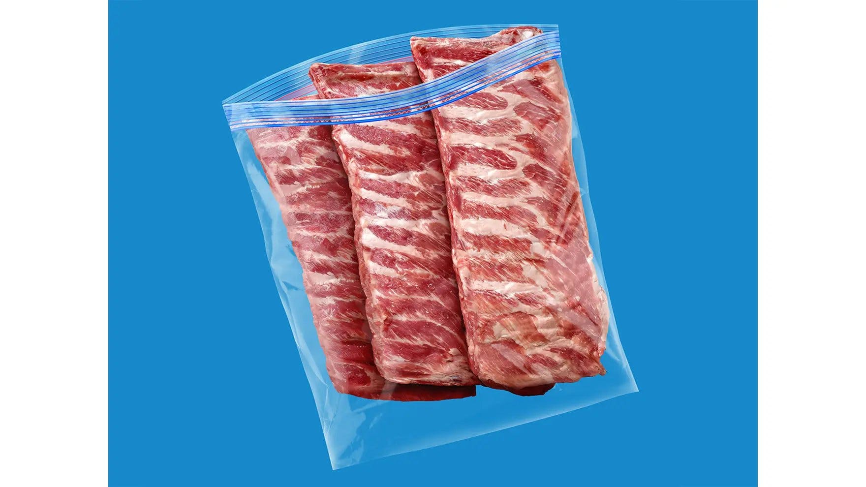 Three racks of ribs inside an Ziploc® brand extra large freezer bag