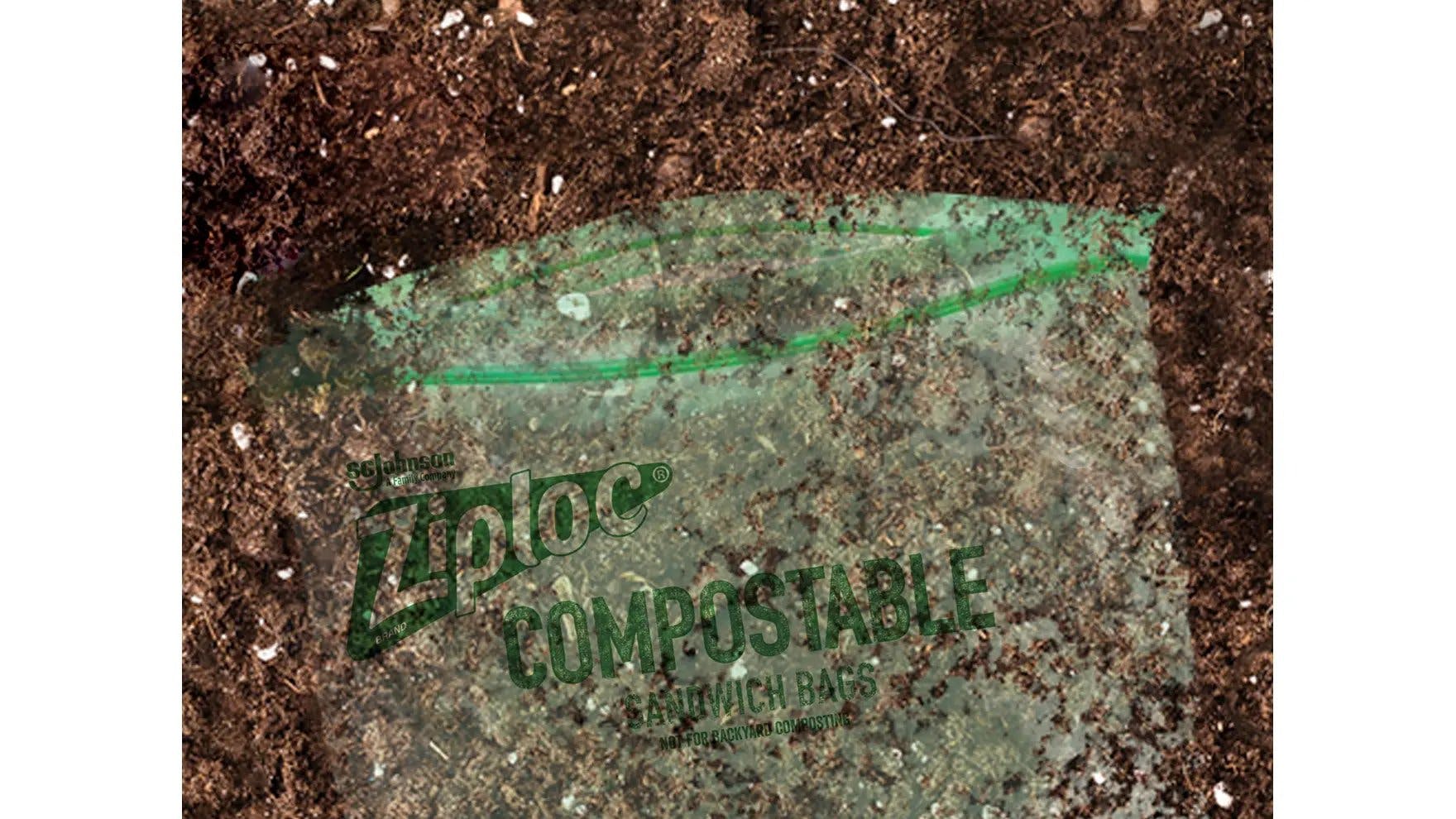 A Ziploc® brand compostable sandwich bag covered in dirt