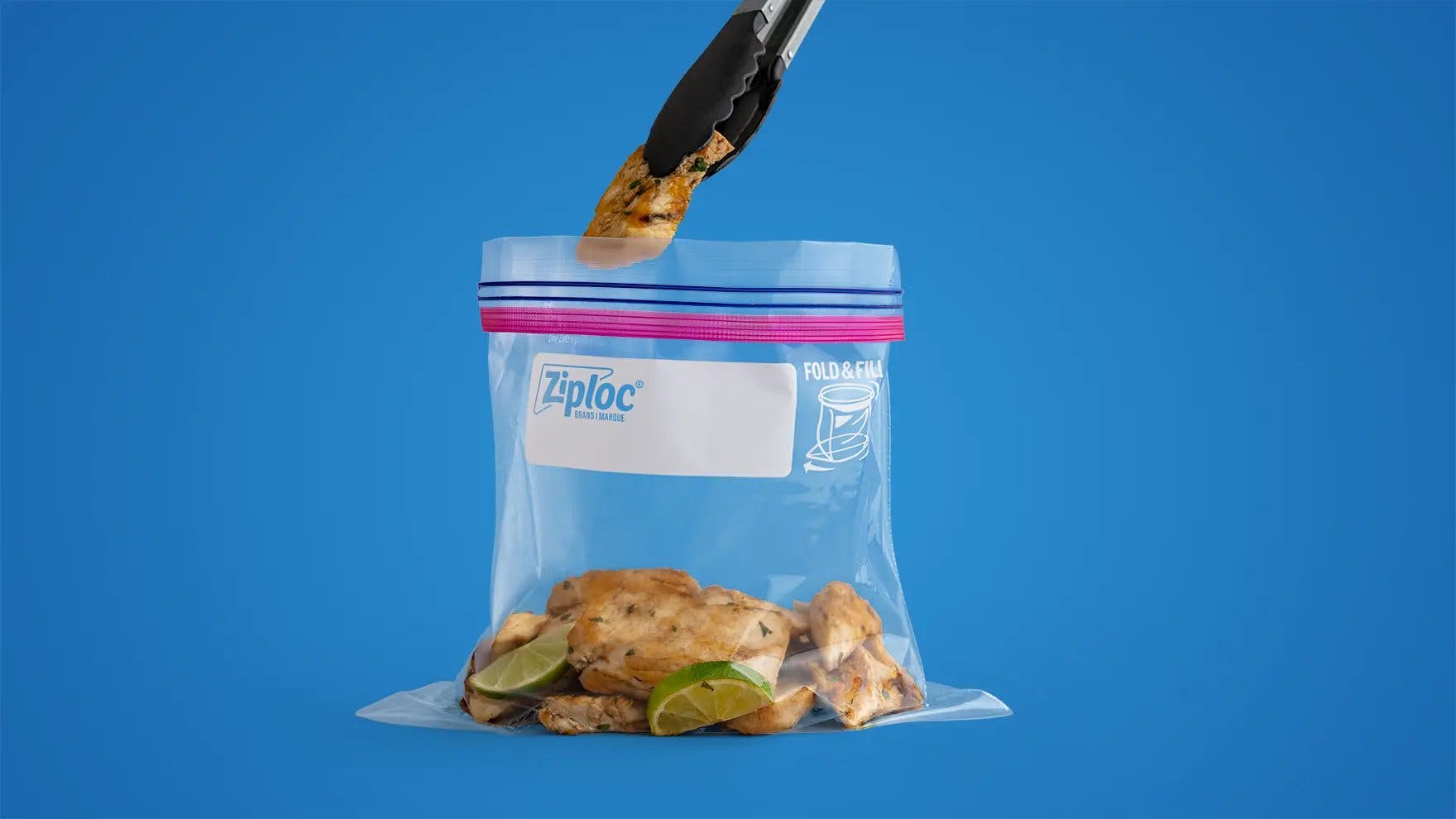 Ziploc large one gallon storage bag filled with chicken and lemon.